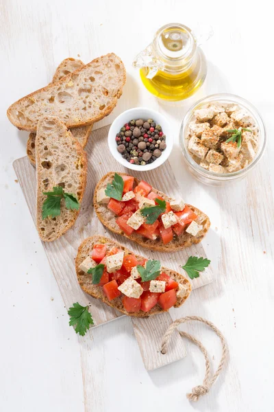 Ciabatta with tomatoes and marinated feta, top view — Stock Photo, Image