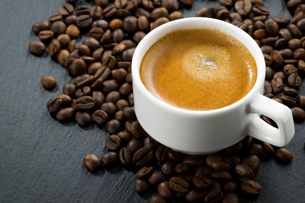 Espresso on coffee beans background Stock Picture