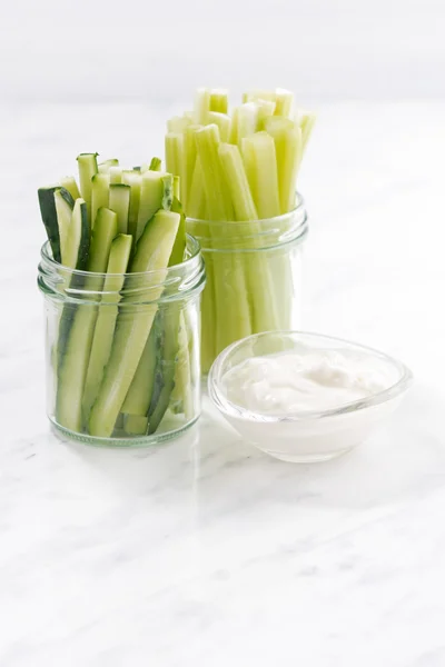 Healthy snacks, green vegetables and yogurt, vertical closeup — Stock Photo, Image
