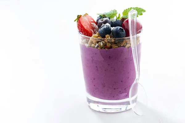 Blueberry yogurt with granola on a white table — Stock Photo, Image