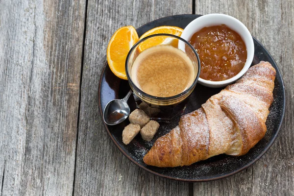 Fresh croissants, coffee and jam, top view — Stock Photo, Image