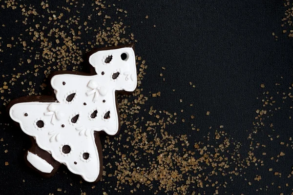 Black background with a gingerbread — Stock Photo, Image