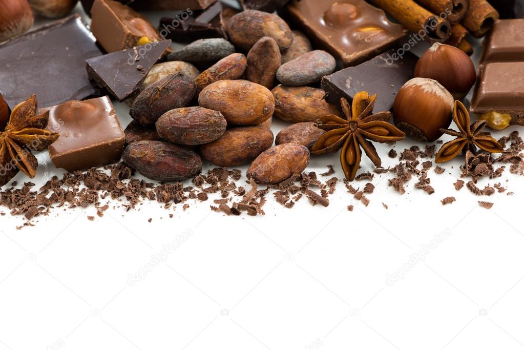 background with cocoa beans, chocolate and spices, isolated