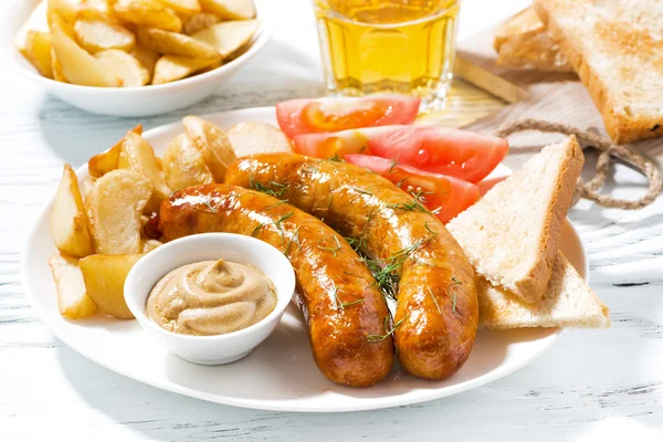 Fried sausages with potatoes and mustard — Stock Photo, Image