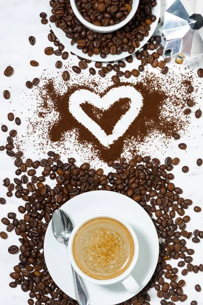 espresso cup, heart and coffee beans conceptual photography, top view