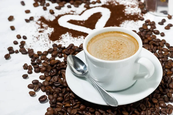 cup of espresso, heart and coffee beans conceptual photography, closeup