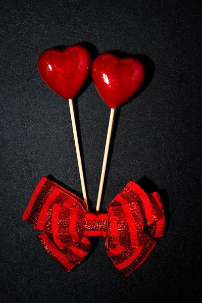 Two Hearts Bow Valentine Day Black Background Closeup Top View — Stock Photo, Image