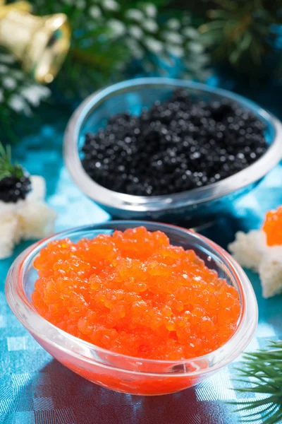 Christmas appetizers - red and black caviar, vertical, close-up — Stock Photo, Image