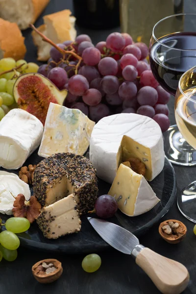 Assorted soft delicacy cheeses and snacks for wine — Stock Photo, Image