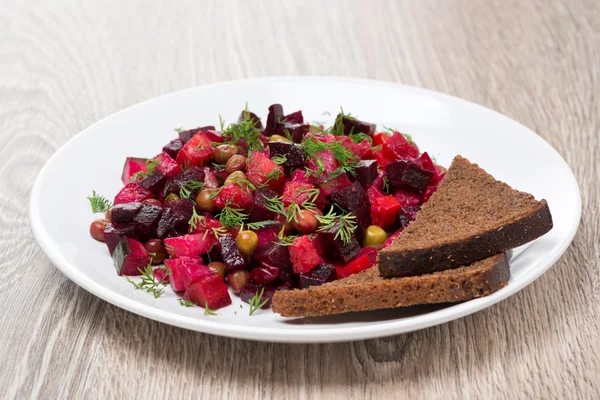 Russian beetroot  salad with bread - vinaigrette — Stock Photo, Image