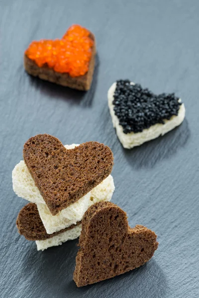 Festive appetizer - toast with red and black caviar — Stock Photo, Image