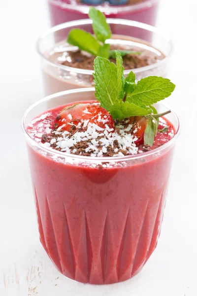 Strawberry, blueberry and chocolate milkshakes in glasses — Stock Photo, Image