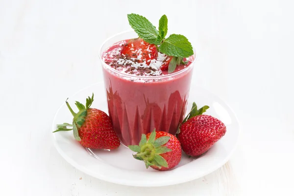 Strawberry milkshake in a glass on white table — Stock Photo, Image