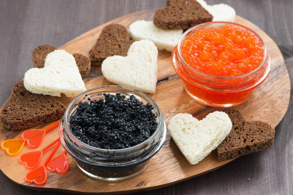 Festive appetizer - toasts, red and black caviar — Stock Photo, Image