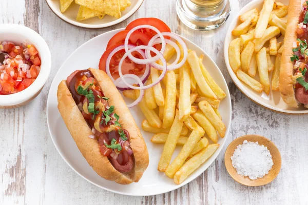 Fast food - hot dog with French fries and chips, top view — Stock Photo, Image