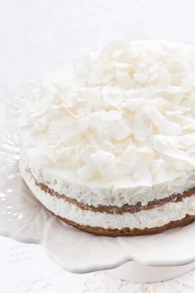 Chocolate cake with coconut cream, vertical close-up Stock Image