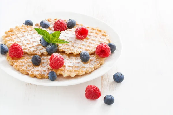 Belgian waffles with fresh berries on white wooden table — Stock Photo, Image