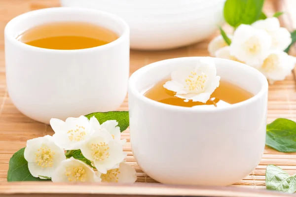 Green jasmine tea in white cups — Stock Photo, Image