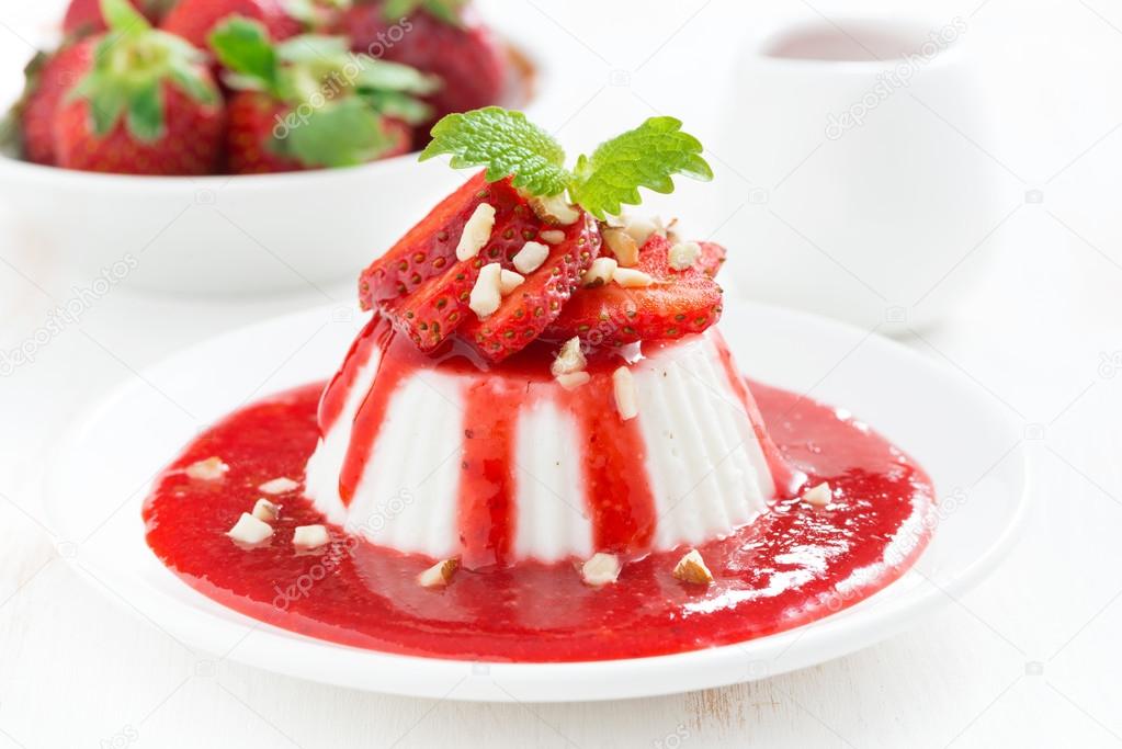 Vanilla panna cotta with strawberry sauce on a plate