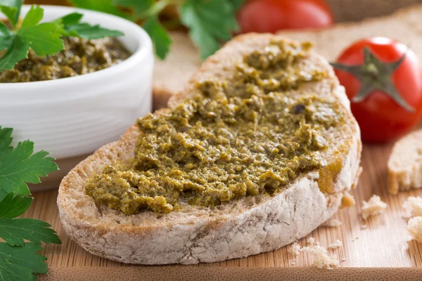 Italian appetizer - ciabatta with pesto, selective focus — Stock Photo, Image