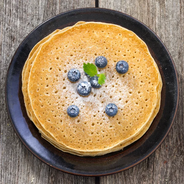 Crepes with blueberries, top view — Stock Photo, Image