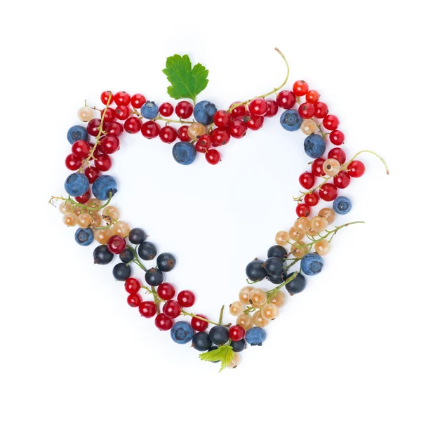 Garden berries in a heart-shaped top view, isolated — Stock Photo, Image