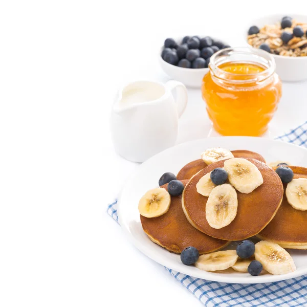 Breakfast - pancakes with banana and blueberries, yogurt — Stock Photo, Image