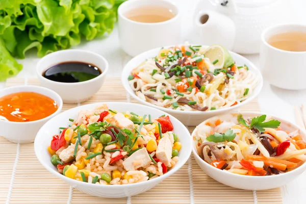 Asian food - fried rice with tofu, noodles with vegetables — Stock Photo, Image