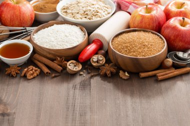 Ingredients for baking cake on a wooden background