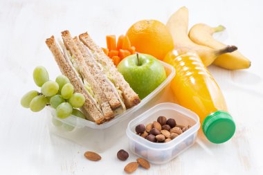 School lunch with sandwich on white table
