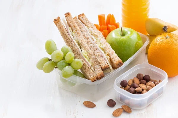 School lunch with sandwich on white wooden table, close-up — Zdjęcie stockowe