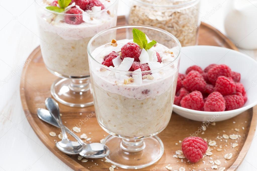 Healthy dessert with oatmeal, whipped cream and raspberries