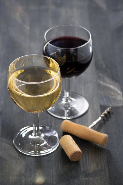 Two glasses of wine on a wooden table — Stock Photo, Image