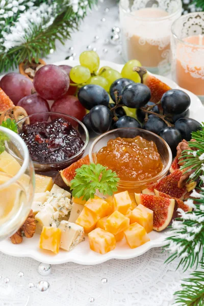Delicacy cheese and fruit plate closeup vertical — Stock Photo, Image