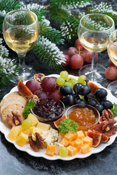 appetizers to the holiday - cheeses, fruits and jams, vertical,