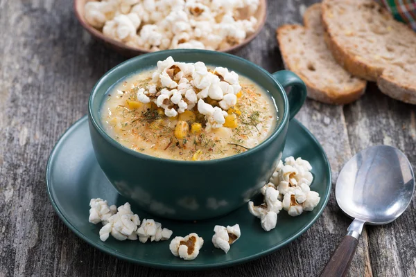 Corn soup with popcorn in cup — Stock Photo, Image