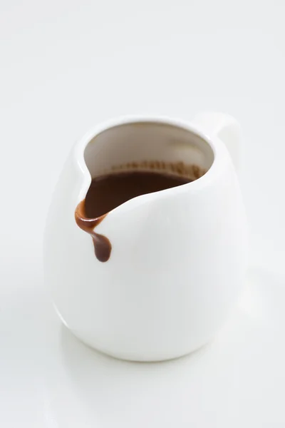 Chocolate sauce in a gravy boat — Stock Photo, Image