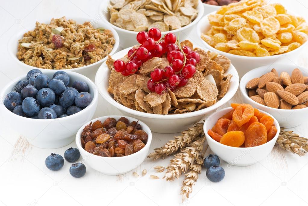 assortment of different breakfast cereal, dried fruit