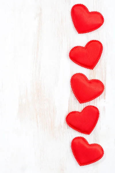 White wooden background with red hearts, vertical — Stock Photo, Image