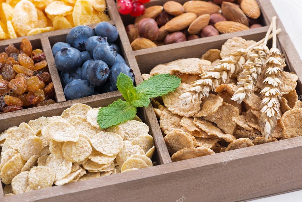 Assortment of breakfast cereal, dried fruit, berries and nuts — Stock