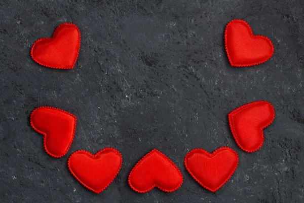 Black background with frames of red hearts — Stock Photo, Image