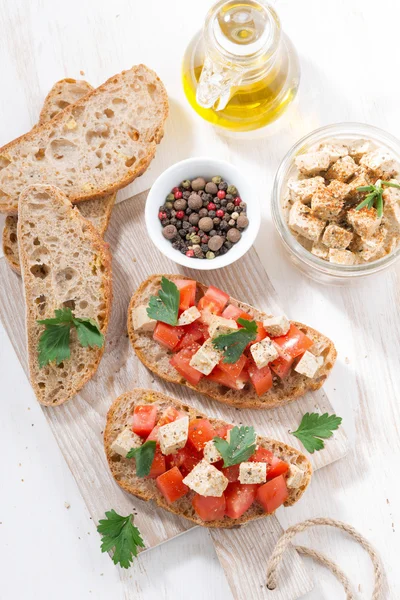 Ciabatta with tomatoes and marinated feta, vertical — Stock Photo, Image