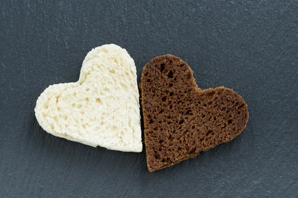 Toasted rye and white bread in the form of heart — Stock Photo, Image