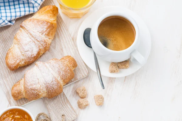 Traditional breakfast with fresh croissants on white — Stock Photo, Image