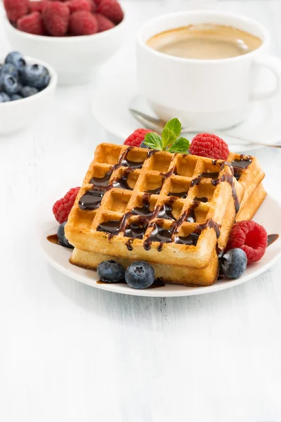 Traditional sweet waffles with chocolate and berries, vertical — Stock Photo, Image