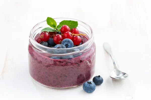 Berry dessert with chia in a glass jar — Stock Photo, Image