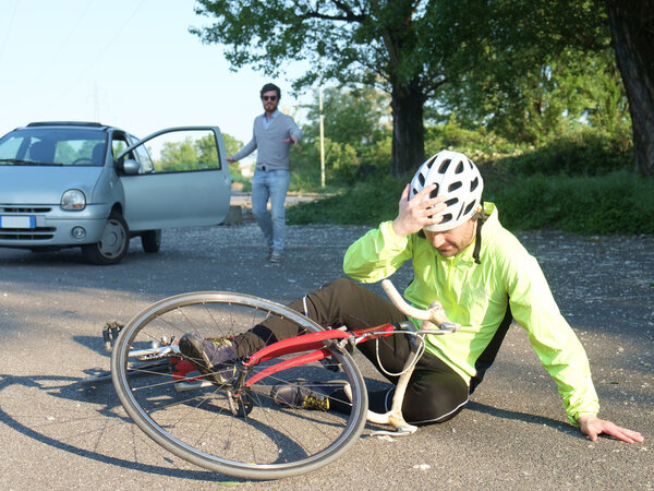 aching man after bicycle accident