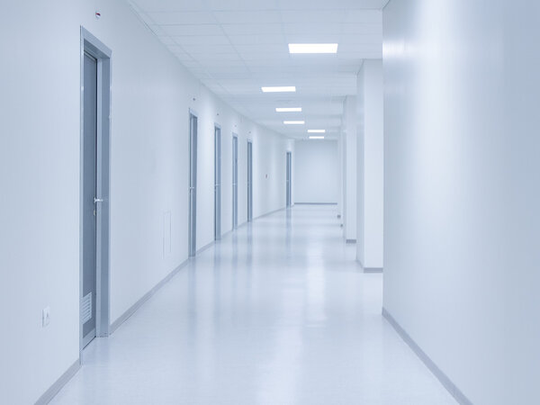 Empty white corridor background with doors