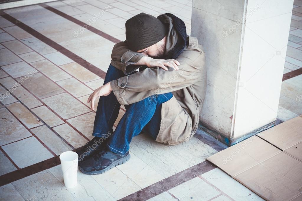 Homeless lying on the street alone 