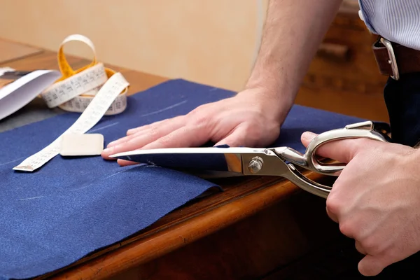 Tailor man working in his tailor shop — Stock Photo, Image